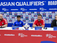 Kuwait team head coach Juan Pizzi (2nd R) and player Redha Abujabarah (2nd L) attend a press conference at Jassim Bin Hamad Stadium in Doha,...