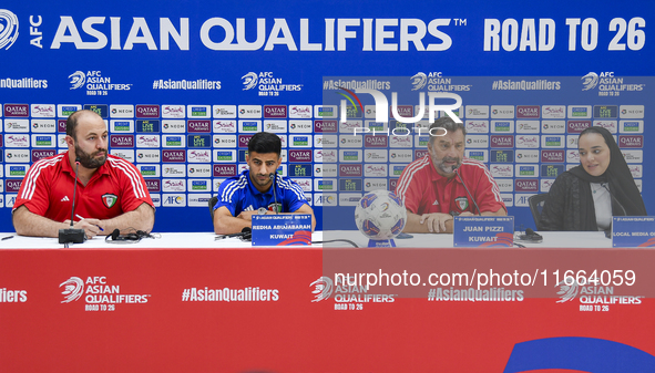 Kuwait team head coach Juan Pizzi (2nd R) and player Redha Abujabarah (2nd L) attend a press conference at Jassim Bin Hamad Stadium in Doha,...