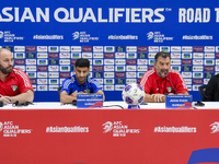 Kuwait team head coach Juan Pizzi (2nd R) and player Redha Abujabarah (2nd L) attend a press conference at Jassim Bin Hamad Stadium in Doha,...