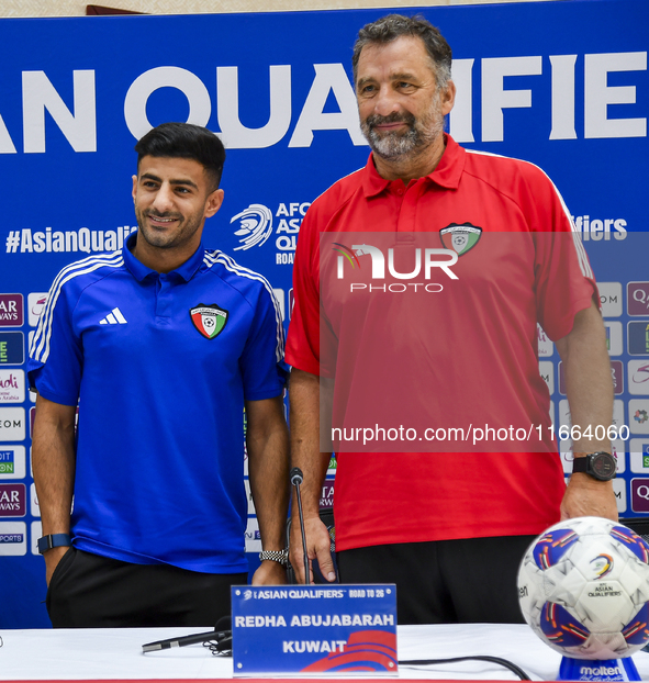 Kuwait team head coach Juan Pizzi (R) and player Redha Abujabarah (L) attend a press conference at Jassim Bin Hamad Stadium in Doha, Qatar,...