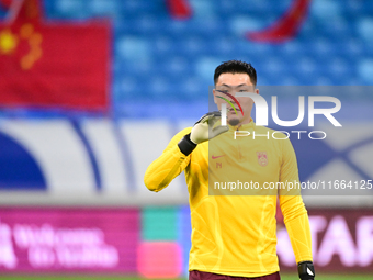 A photo taken on October 14, 2024, shows the Chinese football team during a training session at Qingdao Youth Football Stadium in Shandong p...