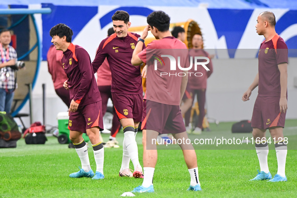 A photo taken on October 14, 2024, shows the Chinese football team during a training session at Qingdao Youth Football Stadium in Shandong p...