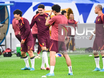 A photo taken on October 14, 2024, shows the Chinese football team during a training session at Qingdao Youth Football Stadium in Shandong p...