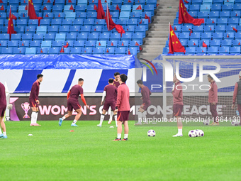 A photo taken on October 14, 2024, shows the Chinese football team during a training session at Qingdao Youth Football Stadium in Shandong p...