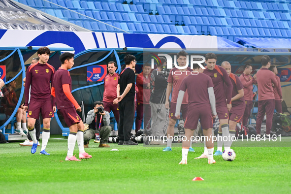 A photo taken on October 14, 2024, shows the Chinese football team during a training session at Qingdao Youth Football Stadium in Shandong p...