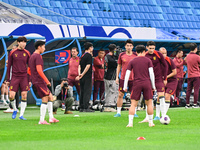 A photo taken on October 14, 2024, shows the Chinese football team during a training session at Qingdao Youth Football Stadium in Shandong p...