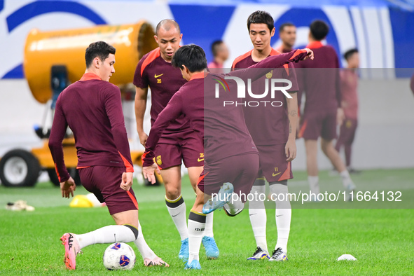 A photo taken on October 14, 2024, shows the Chinese football team during a training session at Qingdao Youth Football Stadium in Shandong p...