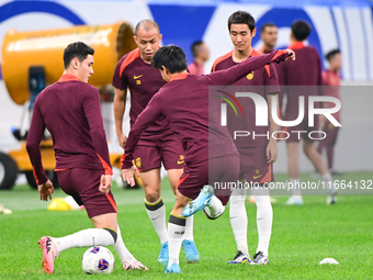 A photo taken on October 14, 2024, shows the Chinese football team during a training session at Qingdao Youth Football Stadium in Shandong p...