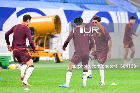 A photo taken on October 14, 2024, shows the Chinese football team during a training session at Qingdao Youth Football Stadium in Shandong p...