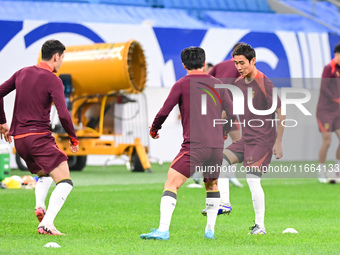 A photo taken on October 14, 2024, shows the Chinese football team during a training session at Qingdao Youth Football Stadium in Shandong p...