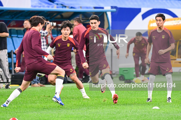 A photo taken on October 14, 2024, shows the Chinese football team during a training session at Qingdao Youth Football Stadium in Shandong p...