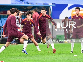 A photo taken on October 14, 2024, shows the Chinese football team during a training session at Qingdao Youth Football Stadium in Shandong p...