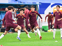 A photo taken on October 14, 2024, shows the Chinese football team during a training session at Qingdao Youth Football Stadium in Shandong p...