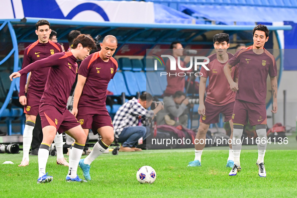 A photo taken on October 14, 2024, shows the Chinese football team during a training session at Qingdao Youth Football Stadium in Shandong p...