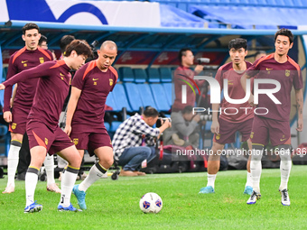 A photo taken on October 14, 2024, shows the Chinese football team during a training session at Qingdao Youth Football Stadium in Shandong p...