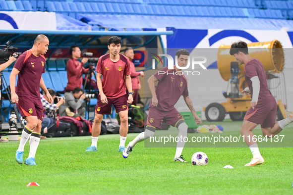 A photo taken on October 14, 2024, shows the Chinese football team during a training session at Qingdao Youth Football Stadium in Shandong p...