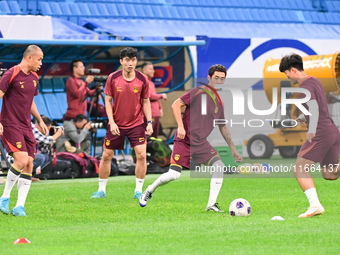 A photo taken on October 14, 2024, shows the Chinese football team during a training session at Qingdao Youth Football Stadium in Shandong p...