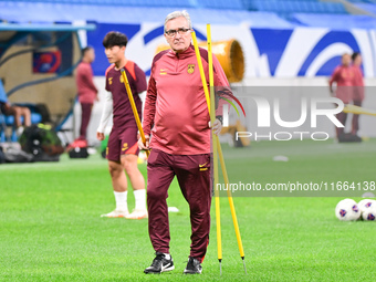 A photo taken on October 14, 2024, shows the Chinese football team during a training session at Qingdao Youth Football Stadium in Shandong p...