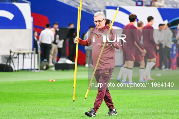 A photo taken on October 14, 2024, shows the Chinese football team during a training session at Qingdao Youth Football Stadium in Shandong p...