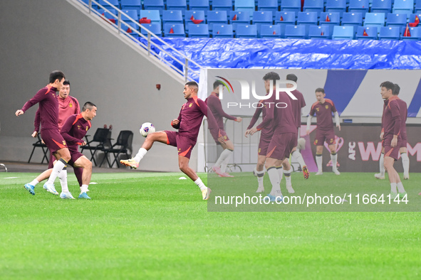 A photo taken on October 14, 2024, shows the Chinese football team during a training session at Qingdao Youth Football Stadium in Shandong p...