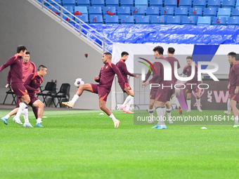 A photo taken on October 14, 2024, shows the Chinese football team during a training session at Qingdao Youth Football Stadium in Shandong p...