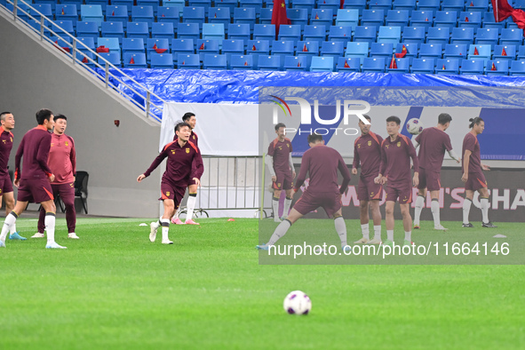 A photo taken on October 14, 2024, shows the Chinese football team during a training session at Qingdao Youth Football Stadium in Shandong p...