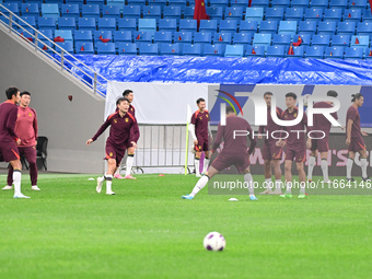 A photo taken on October 14, 2024, shows the Chinese football team during a training session at Qingdao Youth Football Stadium in Shandong p...