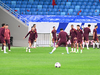 A photo taken on October 14, 2024, shows the Chinese football team during a training session at Qingdao Youth Football Stadium in Shandong p...