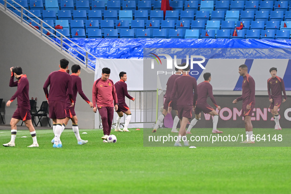 A photo taken on October 14, 2024, shows the Chinese football team during a training session at Qingdao Youth Football Stadium in Shandong p...