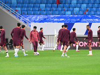 A photo taken on October 14, 2024, shows the Chinese football team during a training session at Qingdao Youth Football Stadium in Shandong p...