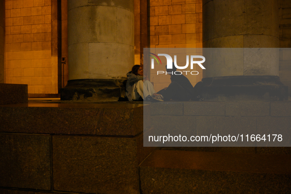 Young people are seen hanging out at the Palace of Culture and Sciences in Warsaw, Poland on 12 October, 2024. 