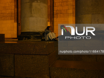 Young people are seen hanging out at the Palace of Culture and Sciences in Warsaw, Poland on 12 October, 2024. (