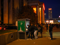 People wait in line to pay parking tickets in Warsaw, Poland on 12 October, 2024. (