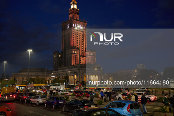 Cars are seen parked at the central train station in front of the Palace of Culture and Sciences in Warsaw, Poland on 12 October, 2024. 