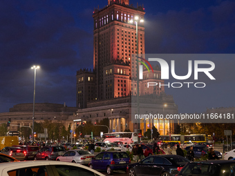 Cars are seen parked at the central train station in front of the Palace of Culture and Sciences in Warsaw, Poland on 12 October, 2024. (