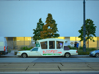 A limousine car with grafitti reading "Bitomat.cim bankomaty bitcoin" is seen in Warsaw, Poland on 12 October, 2024. (