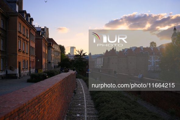 The Old Town city wall i sseen while the sun sets in Warsaw, Poland on 12 October, 2024. 