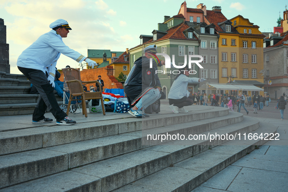 A performer advocating for LGBTQ rights is seen in the Old Town in Warsaw, Poland on 12 October, 2024. 