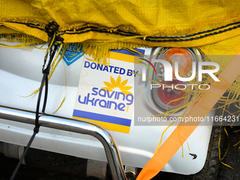 A sticker reading "donated by saving Ukraine" is seen on an electric scooter in Warsaw, Poland on 12 October, 2024. (