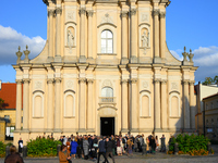 Pepole are seen during a wedding in front of a church in Warsaw, Poland on 12 October, 2024. (