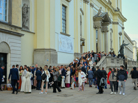 Pepole are seen during a wedding in front of a church in Warsaw, Poland on 12 October, 2024. (