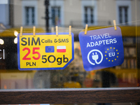 An advertisement for electric travel chargers is seen at a shop in Warsaw, Poland on 12 October, 2024. (