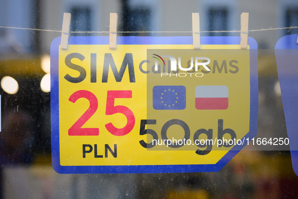 An advertisement for SIM cards is seen in a shop window in Warsaw, Poland on 12 October, 2024. 