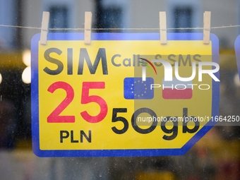 An advertisement for SIM cards is seen in a shop window in Warsaw, Poland on 12 October, 2024. (