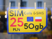 An advertisement for SIM cards is seen in a shop window in Warsaw, Poland on 12 October, 2024. (