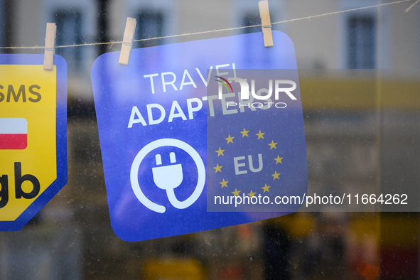 An advertisement for electric travel chargers is seen at a shop in Warsaw, Poland on 12 October, 2024. 