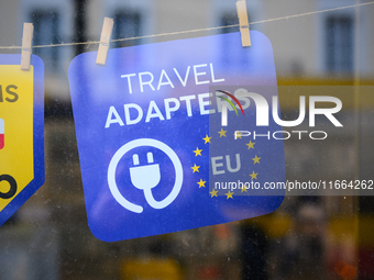 An advertisement for electric travel chargers is seen at a shop in Warsaw, Poland on 12 October, 2024. (