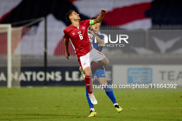 Matthew Guillaumier of Malta competes for the ball with Andrei Motoc of Moldova during the UEFA Nations League, League D, Group D2 soccer ma...