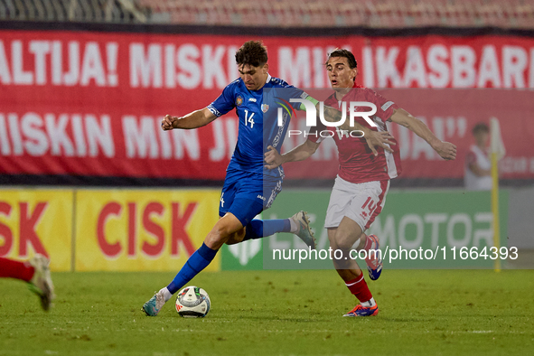 Artur Craciun of Moldova is closely followed by Alexander Satariano of Malta during the UEFA Nations League, League D, Group D2 soccer match...