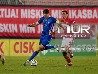 Artur Craciun of Moldova is closely followed by Alexander Satariano of Malta during the UEFA Nations League, League D, Group D2 soccer match...